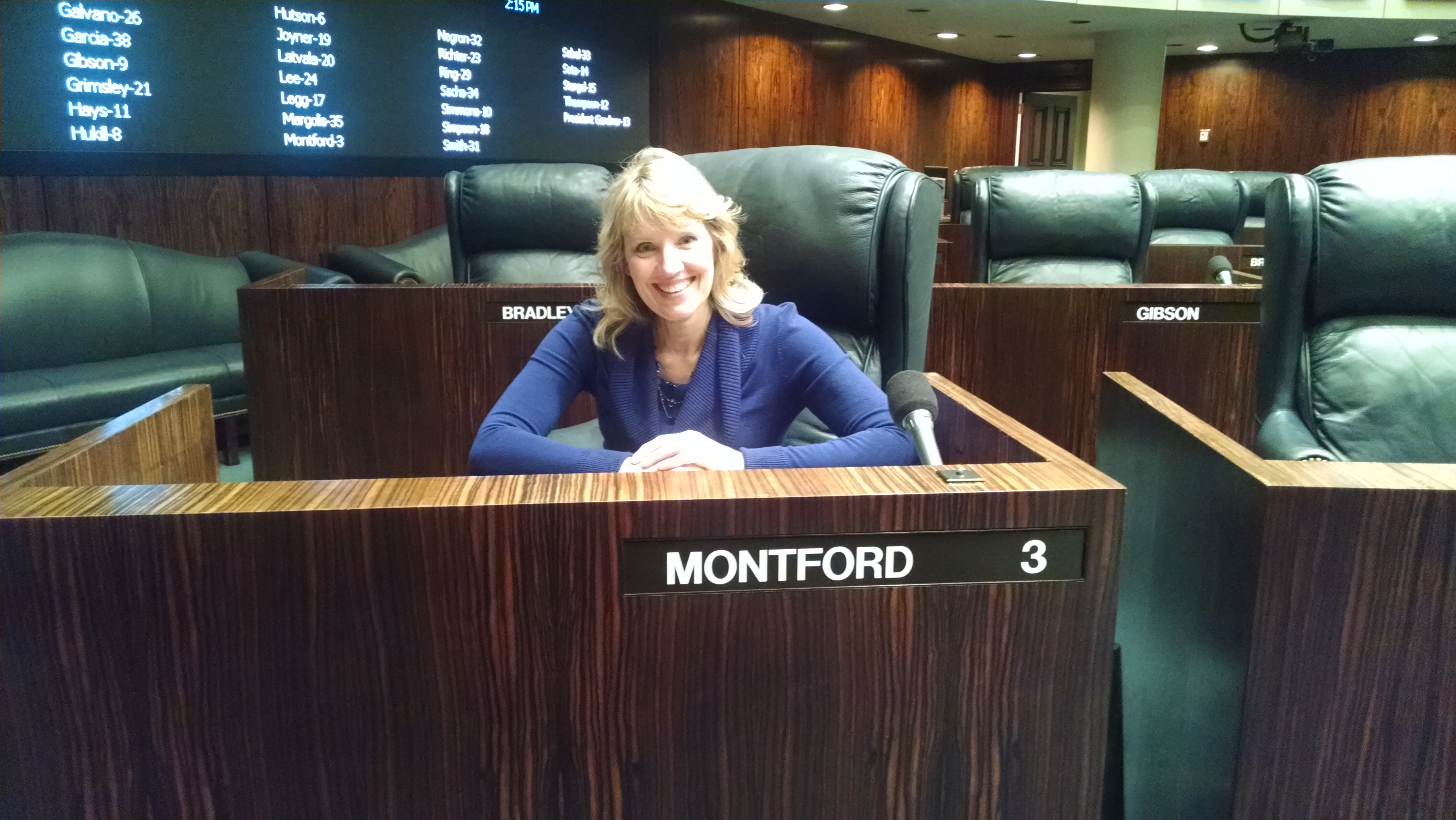 Sabrina Kimball seated at the Montford desk in the Florida Senate chamber.