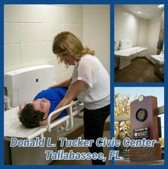 Sabrina Kimball assisting her son, Greyson Channing, on a powered height-adjustable adult changing table at the Donald L. Tucker Civic Center in Tallahassee, Florida.