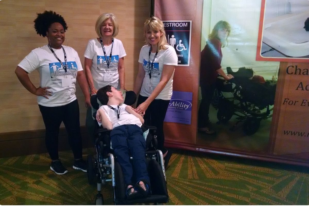 Yvetta Johnson, Deretha Heller, Sabrina Kimball, and her son Greyson Channing advocating for Universal Changing Places at The Family Café in 2017, sponsored by MaxAbility.