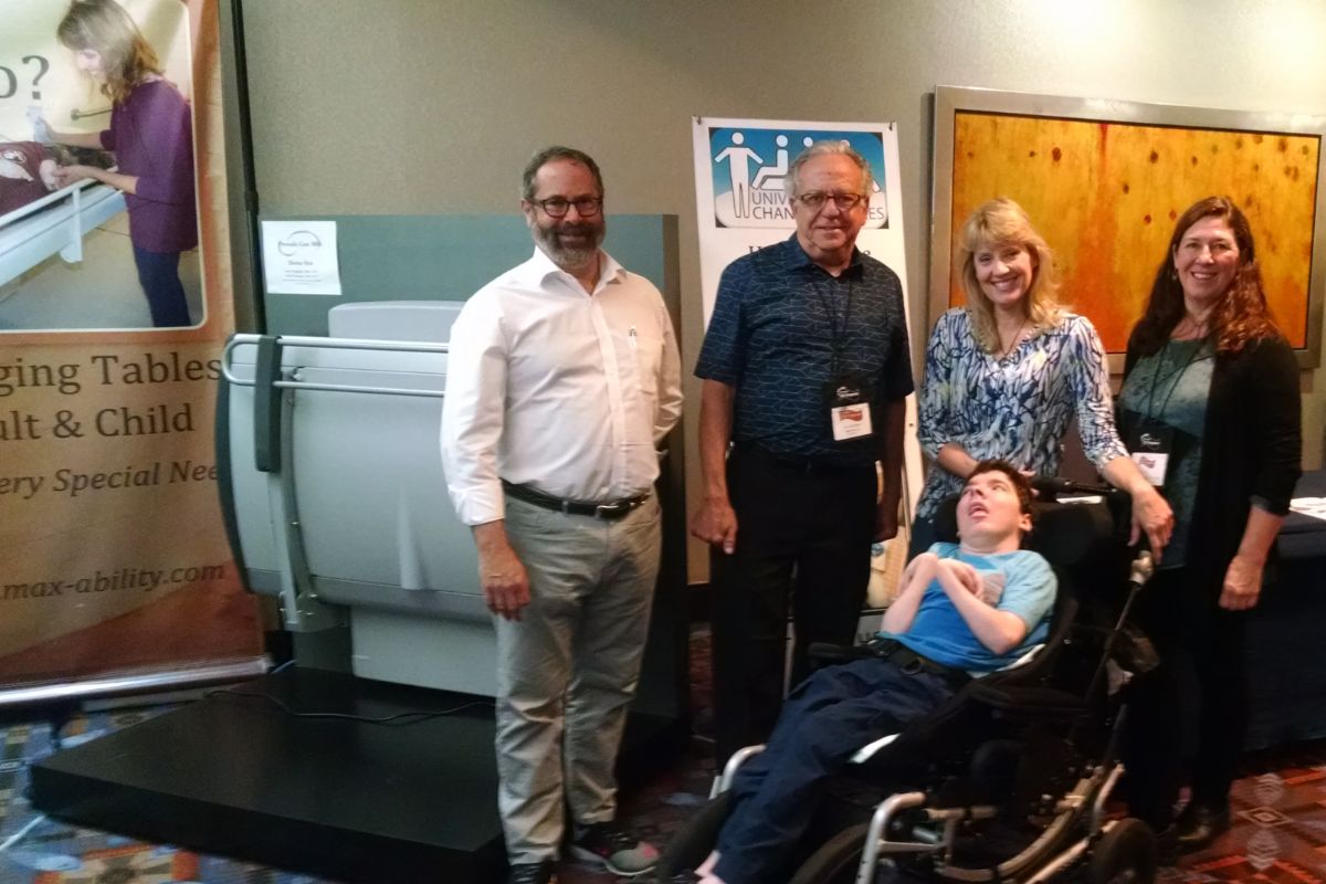 Sabrina Kimball and her son, Greyson Channing, with representatives of their Universal Changing Places sponsors, MaxAbility and Pressalit, at the 2017 ADA Symposium in Chicago, Illinois.